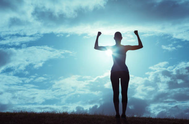 istock Strong woman flexing her muscles 641899264