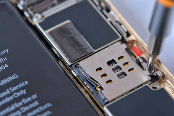 istock Closeup with used smartphone repair with screwdriver 641901210