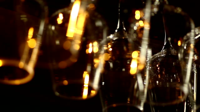 Shot of glasses hanging in a bar