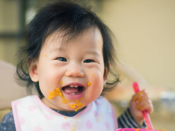 istock eating mess baby girl 641905022