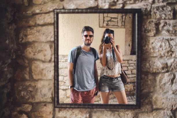 Photographer couple walking in Rovinj on a summertime day