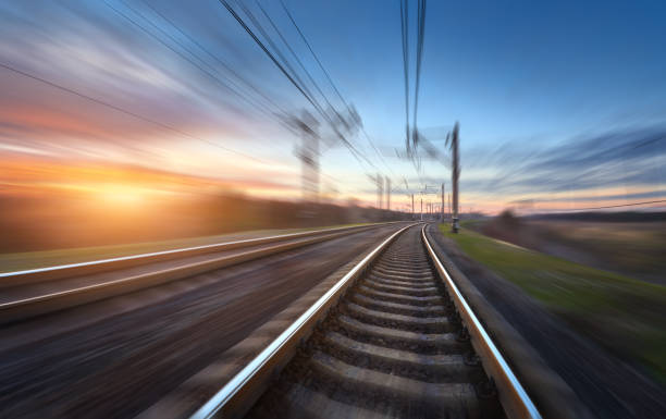 istock Railroad in motion at sunset. Railway station 641910408
