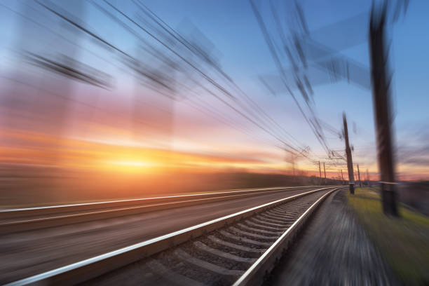 istock Railroad in motion at sunset. Railway station 641910450