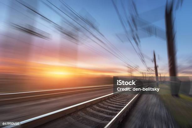 Railroad In Motion At Sunset Railway Station Stock Photo - Download Image Now - Rail Transportation, Railing, Transportation