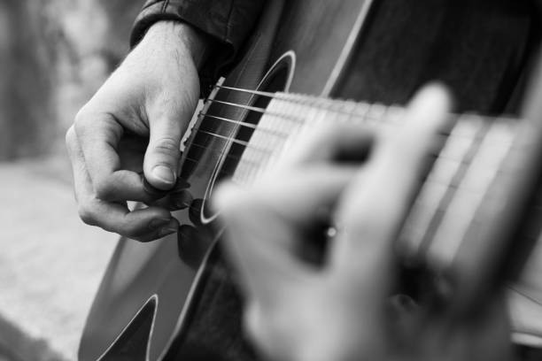 istock Guitar player playing song outdoor 641911760