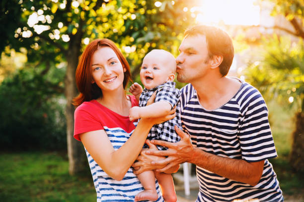 istock Happy family having fun and laughing on a spring summer day at sunset. 641915012