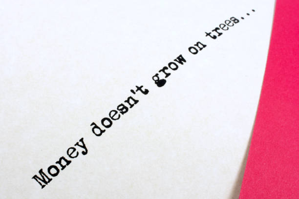 istock The saying, money doesn't grow on trees, on paper 641916528