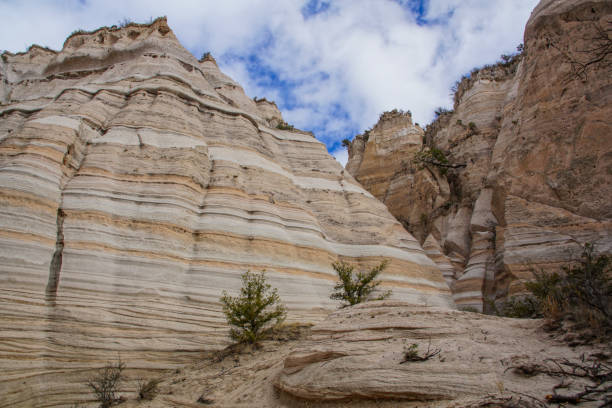 Kasha-Katuwe Tent Rocks National Monument in New Mexico The unique hoodoos that form the main attraction at Kasha-Katuwe Tent Rocks National Park, outside of Albuquerque, New Mexico. This particular morning was unseasonably cold, which resulted in almost no one being in the park. It also allowed the snow from the week before to remain. albuquerque volcanoes stock pictures, royalty-free photos & images