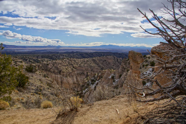 Kasha-Katuwe Tent Rocks National Monument in New Mexico The unique hoodoos that form the main attraction at Kasha-Katuwe Tent Rocks National Park, outside of Albuquerque, New Mexico. This particular morning was unseasonably cold, which resulted in almost no one being in the park. It also allowed the snow from the week before to remain. albuquerque volcanoes stock pictures, royalty-free photos & images
