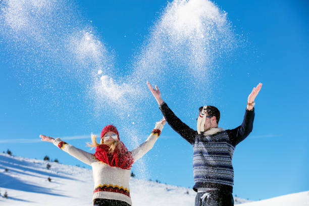 istock Winter couple having fun playing in snow outdoors. 641919020
