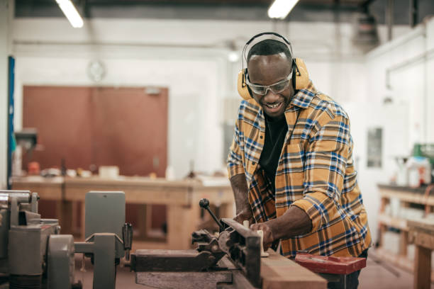 istock Male carpenter working with power tools in his wood shop 641919308