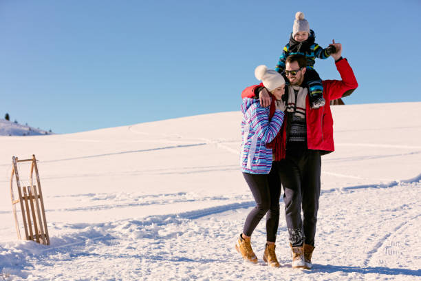 istock Attractive family having fun in a winter park on mountain 641919468