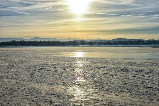 istock Sunset over frozen lake 641920166