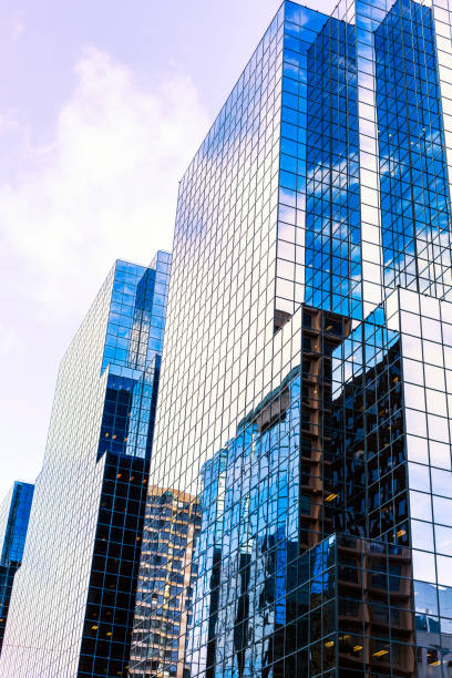 istock Corporate Office Buildings Reflected In Bright Sunshine Skyscraper Windows 641922748