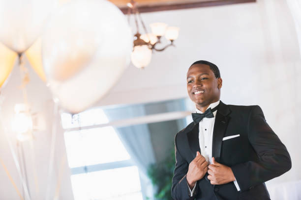 istock Young black Hispanic man wearing tuxedo 641925008