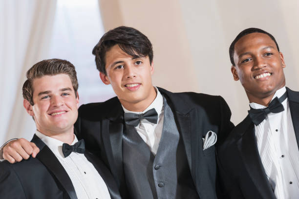 istock Three young men wearing tuxedos 641925044