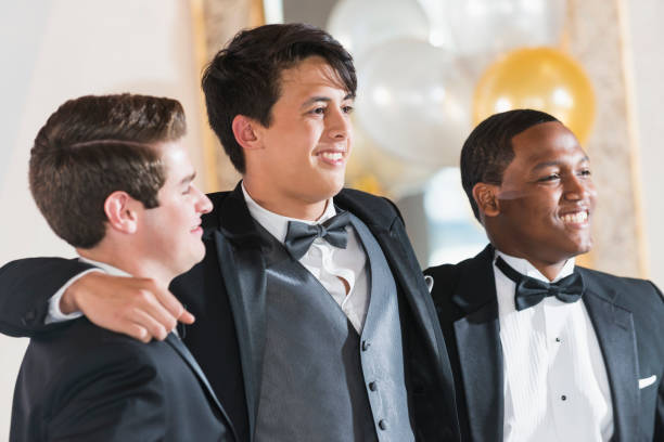istock Three young men wearing tuxedos 641925070