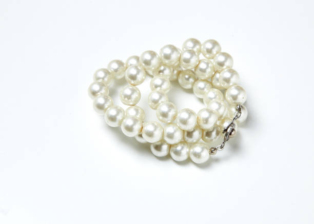 istock pearl necklace isolated on White clouds 641925072