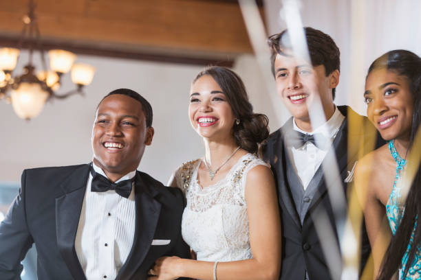 istock Two multi-ethnic couples in tuxedos and dresses 641925110
