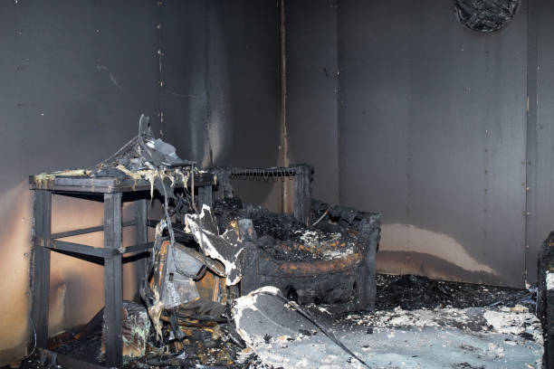chair and furniture in room after burned in burn scene stock photo