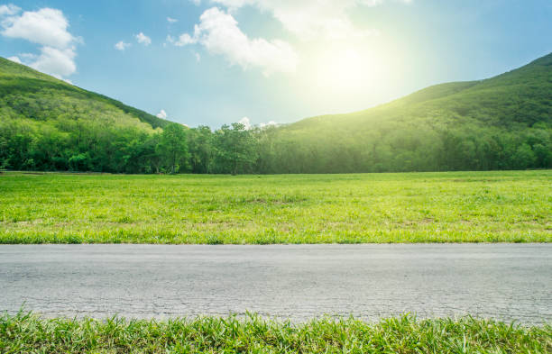 Country Side View on Country Road whit mountain. country road stock pictures, royalty-free photos & images