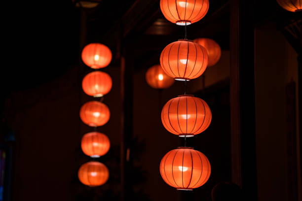 istock Red lanterns hanging in front of old house 641926720