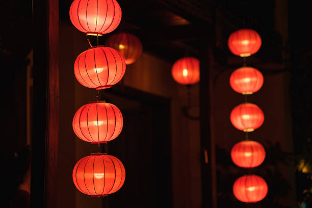 istock Red lanterns hanging in front of old house 641926732