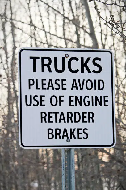 Close Up of Trucks Avoid Retard Brakes Sign