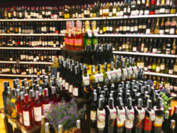 istock Wine Liquor bottle on shelf blurred background 641928520