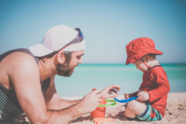istock Father and Son Playing on Tropical Beach, Cayo Coco, Cuba 641928744