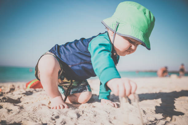 istock Baby Boy Playing on Tropical Beach, Cayo Coco, Cuba 641928766