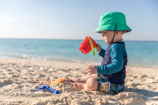 istock Baby Boy Playing on Tropical Beach, Cayo Coco, Cuba 641928774