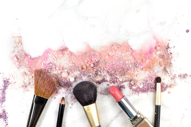 istock Makeup brushes, lipstick and pencil with powder and copyspace 641930554