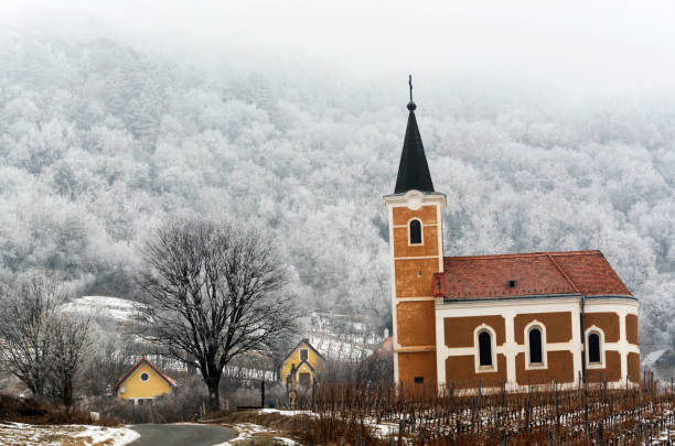istock Old chapel and frozen forest in winter time , Hungary 641933308