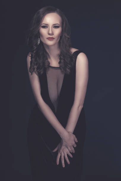 istock attractive woman in black dress 641936498