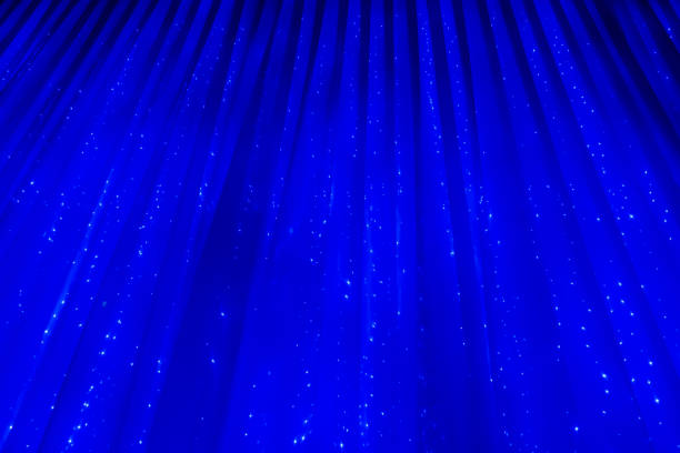 istock Blue abstract background. Curtain with glowing lights 641937206