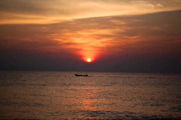 istock sunrise / sunset tropical island 641945080