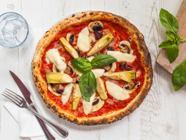 istock Pizza with artichokes top view 641946778