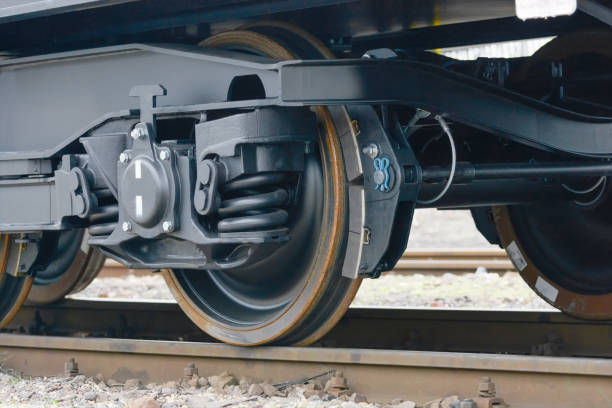 istock Freight (cargo) train - black cars (wagons). Details.New 6-axled flat wagon 641947412