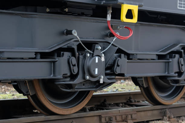 istock Freight (cargo) train - black cars (wagons). Details.New 6-axled flat wagon 641947760