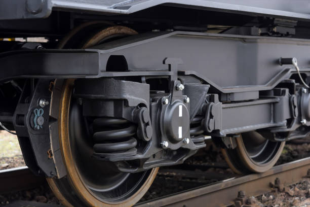 istock Freight (cargo) train - black cars (wagons). Details.New 6-axled flat wagon 641948084