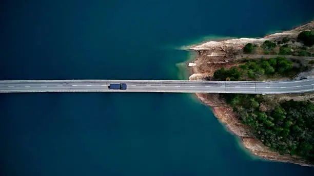 Photo of Aerial View of road above a lake