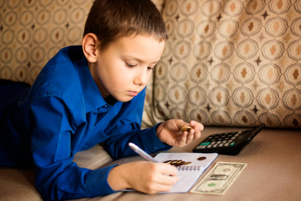 Financial literacy The child is studying Finance financial literacy stock pictures, royalty-free photos & images