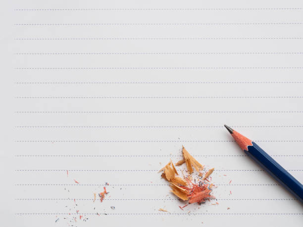 istock Top view of pencil and scape on blank paper 641958102