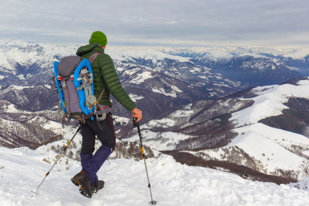 Hiker man trekking winter