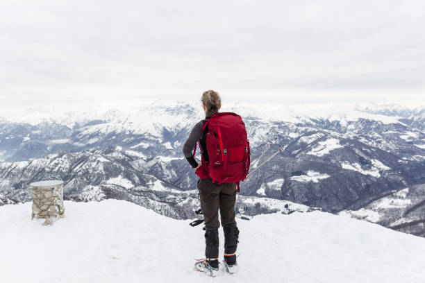 istock Woman hiker with rucksack on top mountain 641958508