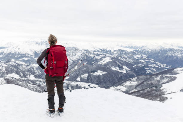 istock Woman hiker with rucksack on top mountain 641958550