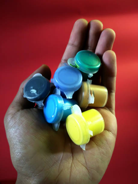 istock multi colored paint tube in hand 641959090