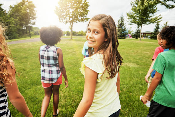 Portrait of a young girl hanging out with her friends outside