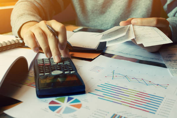 istock Man calculate invoice and receipt with report summary 641960348